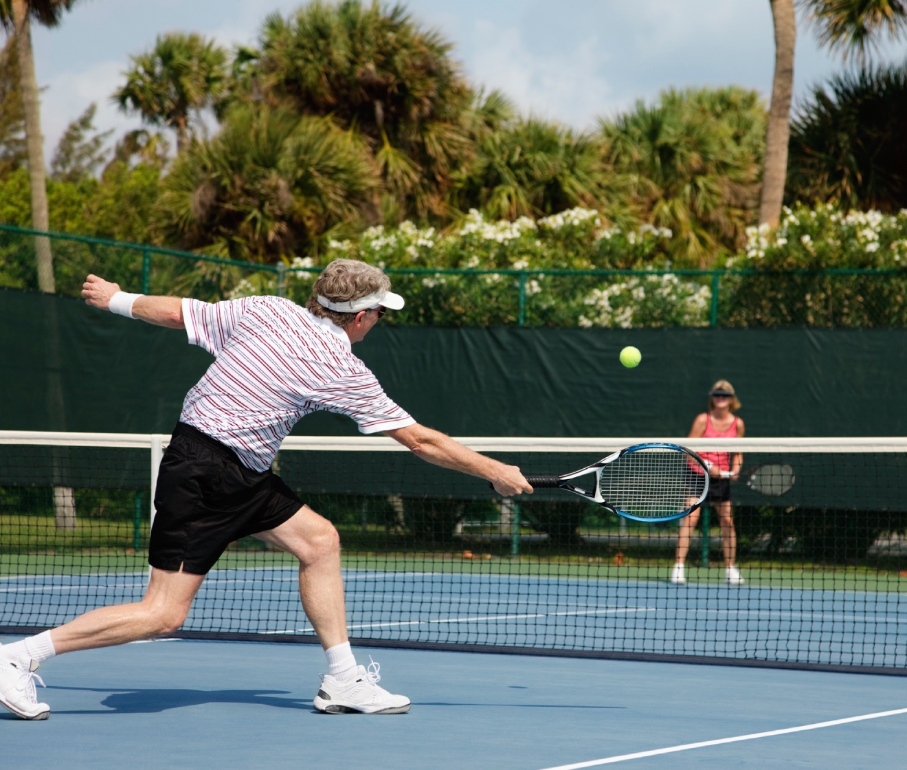 Couple playing tennis